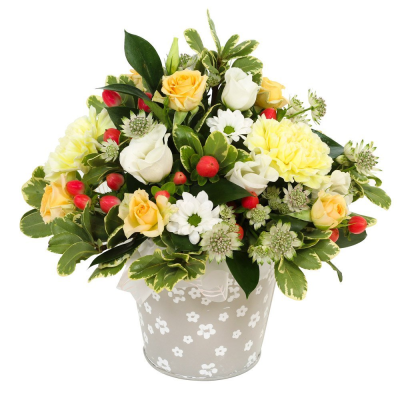 Citrus Berry - A cheerful arrangement bursting with vibrant yellowsand crisp white tones, finished with fresh greenery for a lively look with berries.