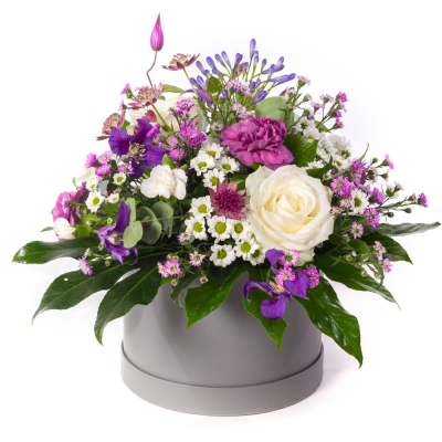 Plum Perfection - A striking arrangement in rich pink, peach and purple tones, beautifully complemented by lush greenery.